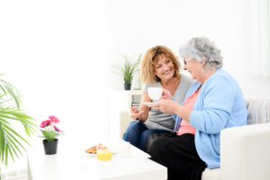 Caregiver and senior woman talking