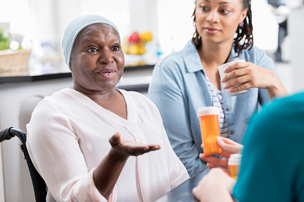 Senior female patient discusses concerns about her medication