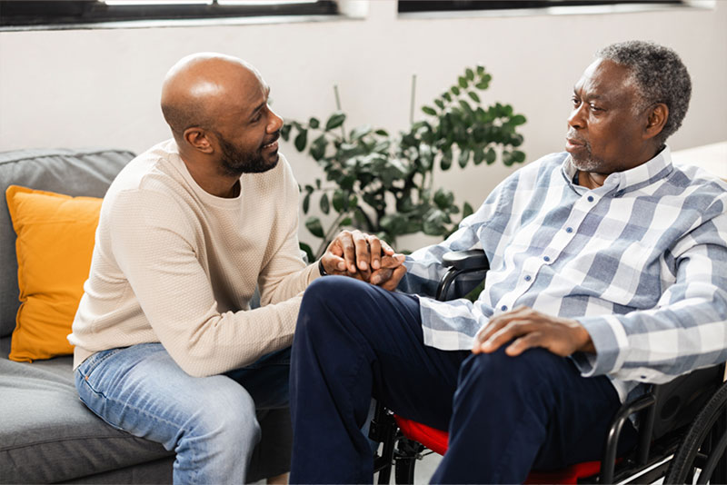 A son talks to his elderly father, trying to avoid common dementia agitation triggers.
