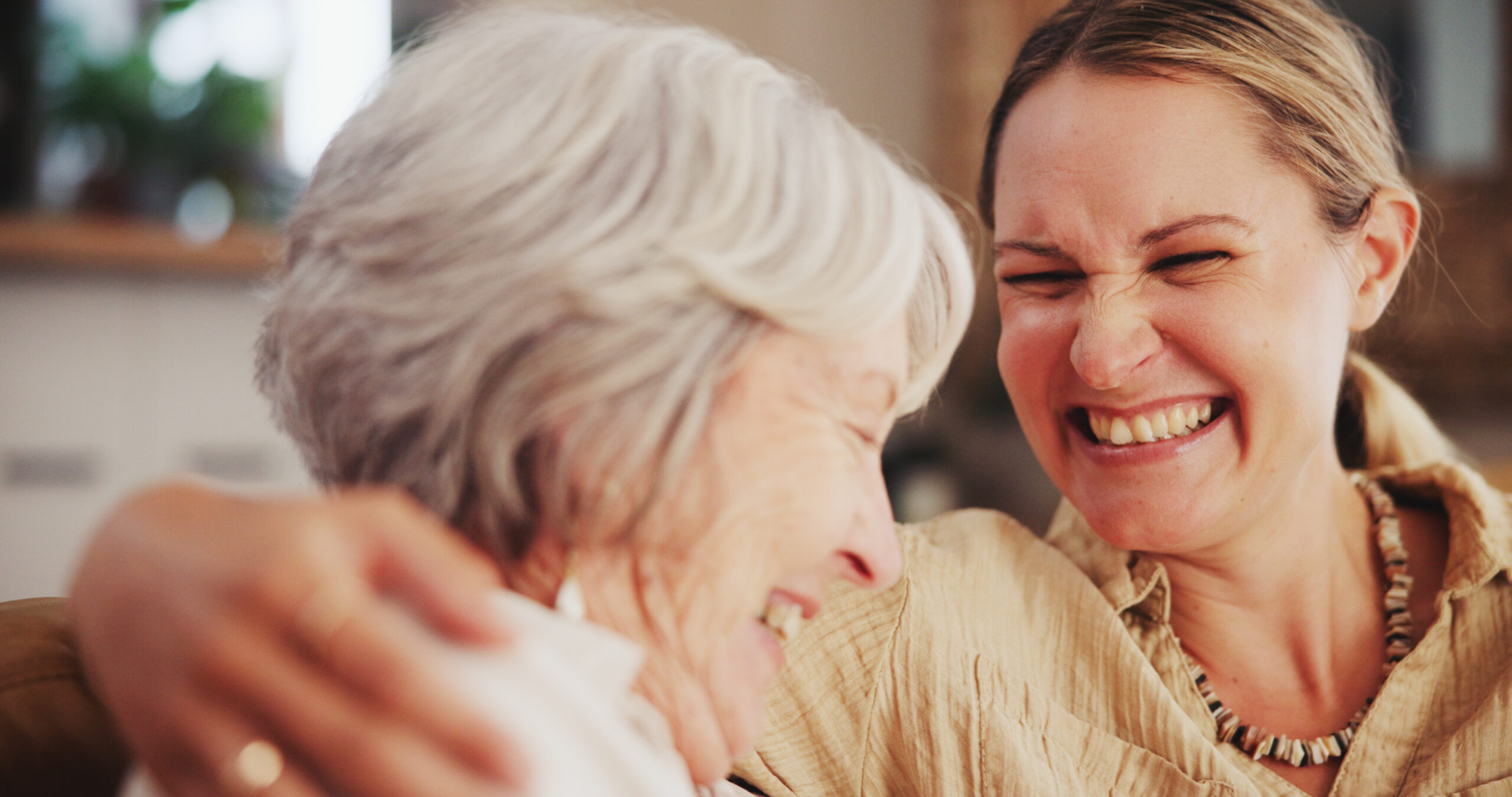 A woman works to support senior emotional health by spending time with a senior loved one.